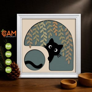May include: A layered paper art piece in a white frame featuring a black cat peeking from behind a beige structure under hanging willow branches against a muted blue background. The design includes cutouts for SVG, PNG, PDF, and DXF file formats.