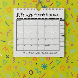 May include: A white calendar for July 2026, hanging against a lime green background with colourful shapes. The calendar has a spiral binding and includes the text "Six months left to panic..." and "July reminder body doubles aren't cheating they're magic."
