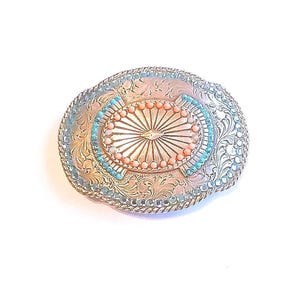 Ornate Belt Buckle Silver Tone Sunburst Design Rhinestones and Beads: Vintage Western Wear from Yours, Occasionally. Marvelous Floral and Sunburst designed buckle features turquoise colored rhinestones around outer edge with turquoise and coral beads in center. It is 3 3/4" long and 3" wide. The vintage* buckle is in excellent vintage* condition. It has been repaired as 4 beads in center were missing. See pictures 4 and 5.