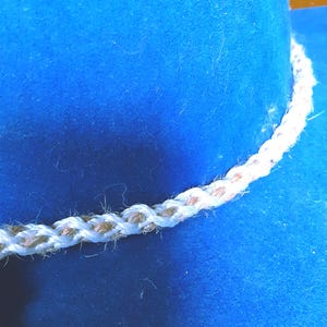 Handmade Kumihimo Braided Hatband: Beige & White Twine Cotton Hat Jewelry from Yours, Occasionally. Kumihimo, braided hatband was made from two different strings. One is twine, one is cotton. The hatband is 25" long and 5/16" wide so it can be tied around your hat. The hatband was made by an artisan in my company.