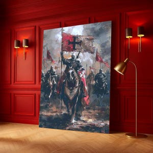 May include: A large canvas print showing a medieval battle scene. Knights in armour on horseback charge forward, led by a knight holding a flag with a cross. The artwork features a muted colour palette with red and grey tones.