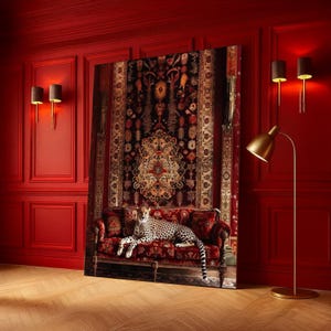 May include: A large, rectangular canvas print featuring a cheetah resting on a red sofa with patterned cushions. The sofa is positioned in front of a large, ornate rug. The room has red walls and a gold floor lamp.