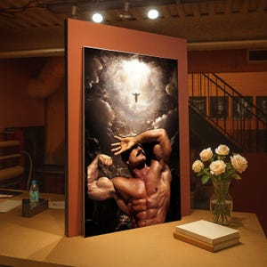 May include: A framed art print featuring a muscular man with a mustache, flexing his arm. The artwork depicts a dramatic scene with a figure in the sky and a cloudy background. A vase of roses and books are on a table.