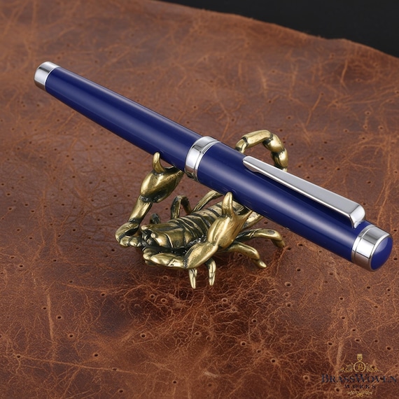 A trio of hand-cast brass scorpions that moonlight as pen holders — equal parts sculpture and office utility, and wildly unlike anything at Staples.