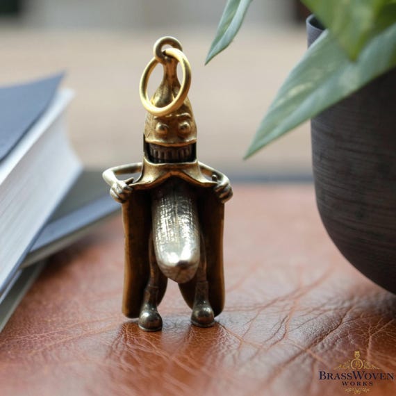 A solid copper banana — hand-forged as a keychain, paperweight, or desk ornament — absurdly specific, retro-artisan, and the kind of object that makes people do a double-take.