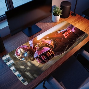 May include: A rectangular desk mousepad featuring a detailed image of Iron Man in a dynamic pose. The design showcases the character's red and gold armor with a focus on the helmet and gauntlet. The mousepad is on a wooden desk.