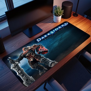 May include: A rectangular gaming mousepad featuring a warrior figure from the Darksiders video game, holding a large sword. The mousepad has a blue and black background with the game's logo in white.