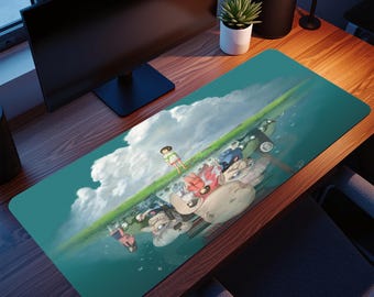 May include: A rectangular desk mat with an anime-style illustration. The design features a green landscape with characters, clouds, and a teal background. The mat is designed to protect the desk surface.