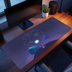 May include: A long, rectangular desk mat with a space-themed design, including planets, stars, and a figure on a planet's surface. The mat has a purple and blue colour scheme, with a dark border. The mat is on a wooden desk.