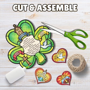 May include: A craft kit with a shamrock-shaped cutout, labeled "Father," "Son," and "Holy Spirit," with text about the Trinity. Includes heart-shaped cutouts, scissors, glue, and twine. The words "Cut & Assemble" are at the top.