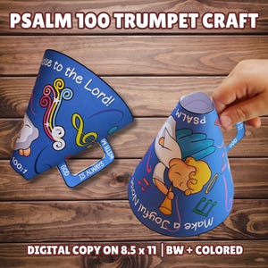 Op de afbeelding: Blauwe papieren trompetknutsel met de tekst "Psalm 100 Trumpet Craft". De trompet heeft illustraties van muzieknoten, een wolk en een engel die trompet speelt. De tekst "Make a Joyful Noise" is ook zichtbaar.