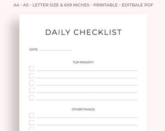 May include: A white printable daily checklist with the title "DAILY CHECKLIST" in a bold, gray font. The checklist includes sections for "DATE:" and "TOP PRIORITY" and "OTHER THINGS". The paper size is 6x9 inches.