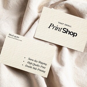 May include: Two textured business cards with the text "THAT SMALL Print Shop" in black. One card has the text "Mock up for 300gsm Textured Business Cards". The other card has bullet points with the text "Same day Shipping, High Quality Print, Double Side Printing".