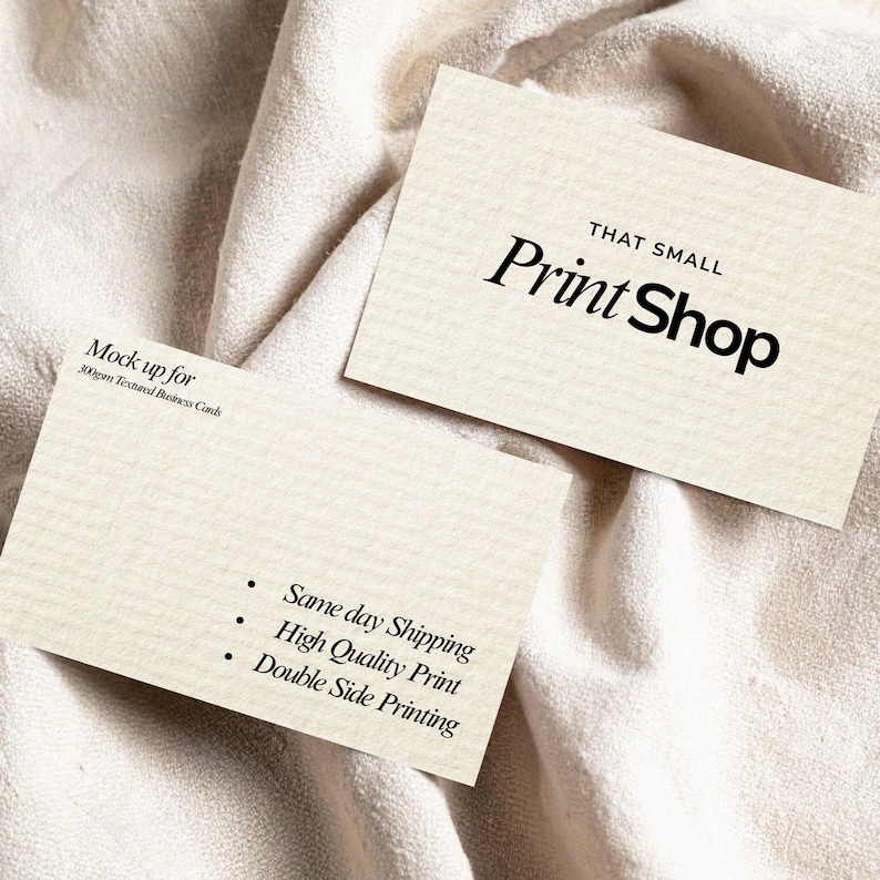 May include: Two textured business cards with the text "THAT SMALL Print Shop" in black. One card has the text "Mock up for 300gsm Textured Business Cards". The other card has bullet points with the text "Same day Shipping, High Quality Print, Double Side Printing".