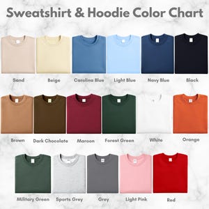 May include: A color chart displaying various sweatshirt and hoodie colors. Colors include sand, beige, Carolina blue, light blue, navy blue, black, brown, dark chocolate, maroon, forest green, white, orange, military green, sports grey, grey, light pink, and red.
