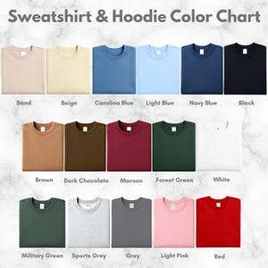 May include: Color chart of sweatshirts and hoodies in various colors. The chart includes Sand, Beige, Carolina Blue, Light Blue, Navy Blue, Black, Brown, Dark Chocolate, Maroon, Forest Green, White, Military Green, Sports Grey, Grey, Light Pink, and Red.