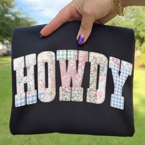 May include: A handmade wooden sign with the text "Welcome" in a handwritten style. The sign is painted white with a distressed finish, and a small green leaf is attached to the top. The sign is designed for indoor or outdoor use.