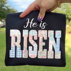 May include: A set of three ceramic mugs with a speckled, matte finish. The mugs are in shades of cream, light gray, and dark gray. Each mug has a simple, minimalist design, perfect for coffee or tea.