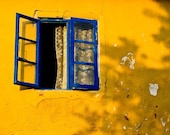 Mediterranean Summer - A Fine Art Photograph - A bright blue open window against a rustic yellow wall in Turkey