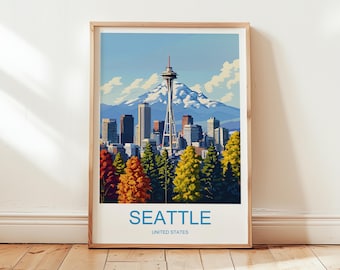 May include: A framed art print depicting the Seattle skyline, including the Space Needle, against a backdrop of mountains and a blue sky. The foreground features trees in autumnal colours. The word "SEATTLE" is printed at the bottom, with "UNITED STATES" below.