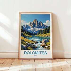 May include: Framed art print featuring a scenic landscape of the Dolomites in Italy. The artwork depicts a mountain range, a lake, and lush greenery under a clear blue sky. The word "DOLOMITES" and "ITALY" are printed at the bottom.