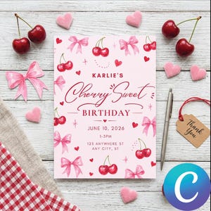 May include: A pink birthday invitation with the text "Karlie's Cherry Sweet Birthday" and cherry illustrations. The invitation includes the date, time, and address. Decorative pink bows, hearts, and cherries surround the text. A pen and a "Thank You" tag are also present.