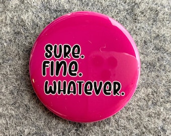 May include: A pink button with the text "sure. fine. whatever." in black.