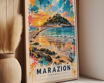 May include: A rectangular framed wall art print featuring a watercolour-style landscape of St. Michael's Mount in Marazion, Cornwall. The image displays a castle on a hill, a causeway, and a sunset with vibrant blue, orange, and pink paint splatters.