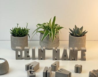 Lettere concrete con testo personalizzato