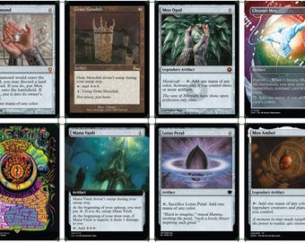 May include: A collection of eight Magic: The Gathering trading cards arranged in two rows. The cards feature various illustrations including a hand holding a diamond, a stone tower, a glowing orb, a blue creature, a ring, a structure, a petal, and an amber stone.