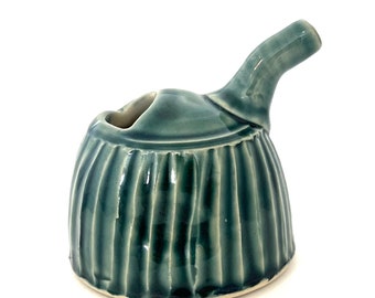 Pourer, creamer, soy sauce pot in rainforest