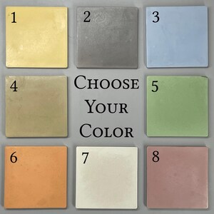 May include: A grid of eight square tiles in various colors, including yellow, gray, light blue, olive, green, orange, cream, and mauve. The text "CHOOSE YOUR COLOR" is centered between the tiles.