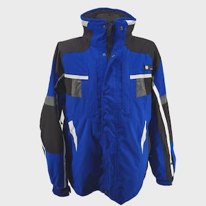 May include: A blue and black winter jacket with a high collar. The jacket features white and gray accents, a zipper closure, and multiple pockets. The jacket has a snowflake logo on the chest and is designed for cold weather.