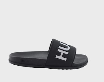 Vintage schoenen Hugo: klassieke zwarte slippers voor liefhebbers van retrostijl