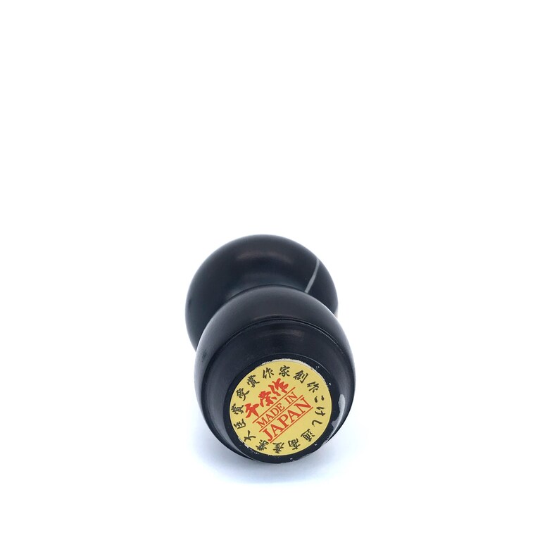 May include: Black inkwell with a gold label that reads "Made in Japan" in red letters and Japanese characters.