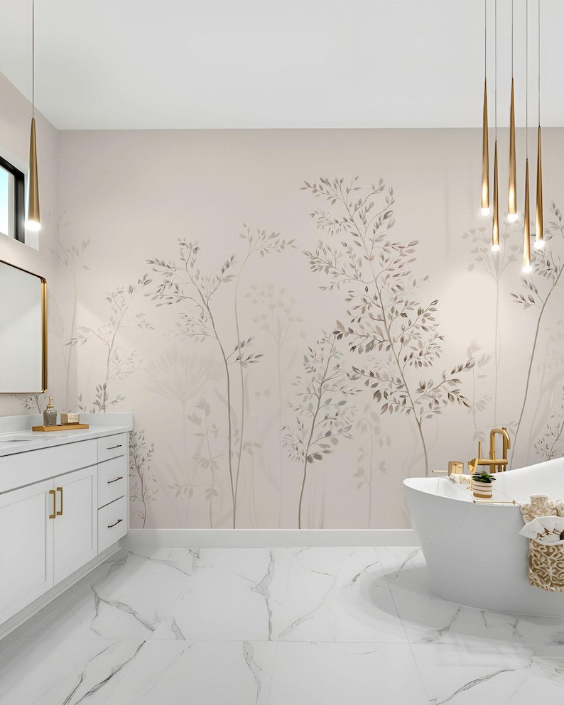May include: A modern bathroom with a white freestanding bathtub, white vanity, and marble tile flooring. The wall features a beige mural with a botanical design. Gold-toned pendant lights hang above the tub, adding a touch of luxury.