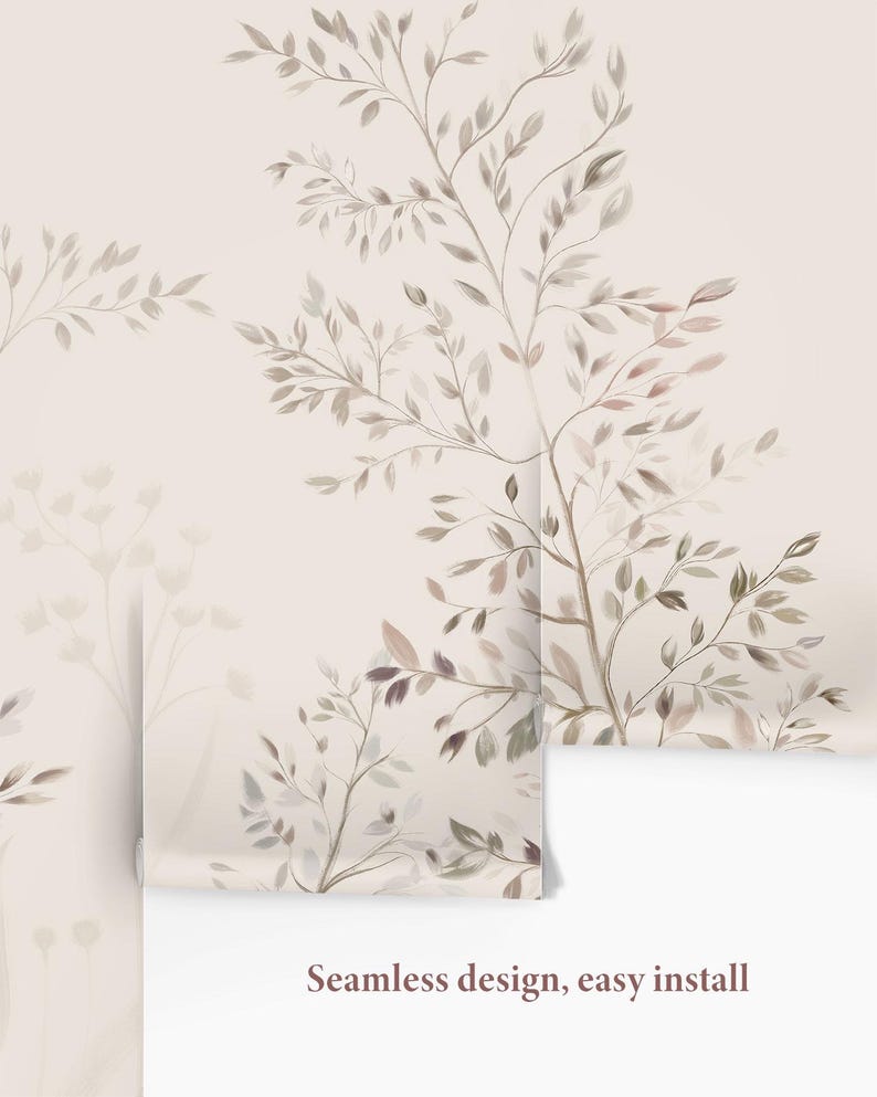 May include: A roll of wallpaper featuring a watercolor design of tree branches and leaves in shades of brown, beige, and gray. The background is a light beige color. The text "Seamless design, easy install" is visible.