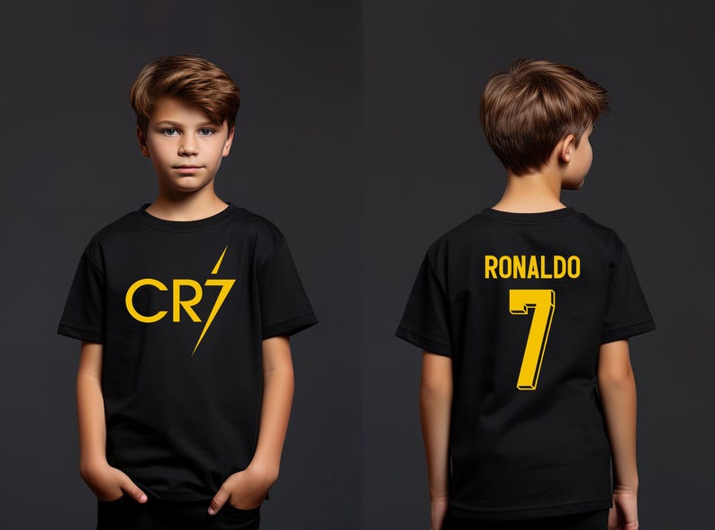a young boy wearing a black shirt with the number seven on it