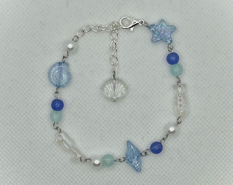 Bracciale con ciondolo oceano: conchiglia, stella marina e pesce - Gioielli da spiaggia regolabili