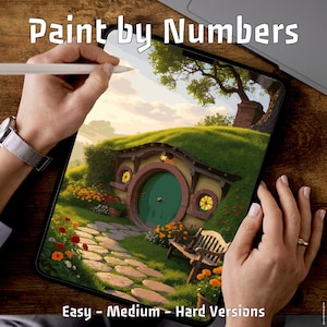 May include: A digital paint-by-numbers scene of a hobbit hole with a green door, stone path, and bench. The tablet displays the artwork, with the text "Paint by Numbers" at the top and "Easy - Medium - Hard Versions" at the bottom. A stylus is held over the screen.