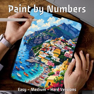 May include: A digital paint-by-numbers art project depicting a vibrant coastal town with boats. The image includes the text "Paint by Numbers" at the top and "Easy - Medium - Hard Versions" at the bottom.