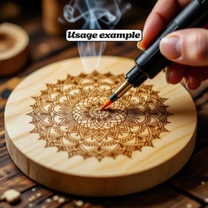 May include: A round, light-colored wooden coaster with a detailed mandala design. A black pen with a red tip is shown in use, with the text "Usage example" in a white box. Smoke rises from the coaster.