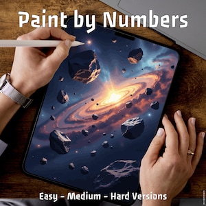 May include: A digital paint-by-numbers kit featuring a galaxy design with a spiral galaxy and floating asteroids. The tablet displays the artwork, with the text "Paint by Numbers" at the top and "Easy - Medium - Hard Versions" at the bottom.
