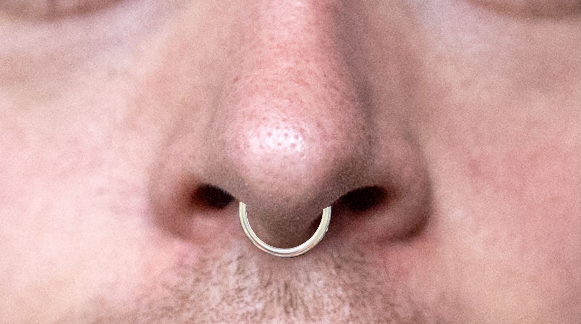 Septum piercing mann