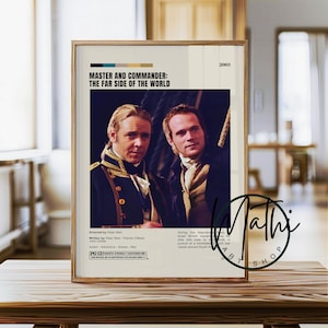 May include: Framed movie poster for "Master and Commander: The Far Side of the World" (2003). The poster features two men in period attire, with text including the film's title, director, and rating. The poster is in a gold frame.
