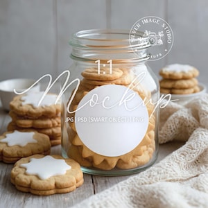 May include: A clear glass jar filled with cookies, with a white circle for a mockup. The cookies are golden brown with white icing. The image includes text that says "1:1 Mockup" and "Silver Image Studio".