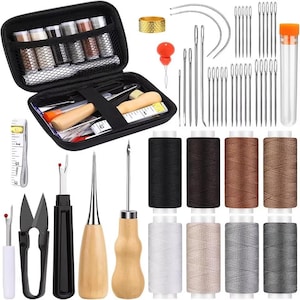 May include: A black sewing kit containing a variety of tools and materials. Includes spools of thread, needles, scissors, seam rippers, a thimble, and a measuring tape. The kit is designed for sewing and craft projects.