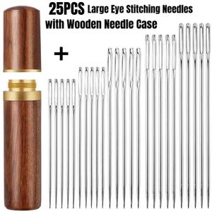 May include: A set of 25 large-eye stitching needles with a wooden needle case. The case is cylindrical, with a dark wood finish and a brass-colored metal accent. The needles are silver and vary in length.