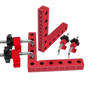 May include: A set of red aluminum right angle squares with black knobs and silver hardware. The squares have measurement markings in centimetres and are designed for woodworking or construction projects.