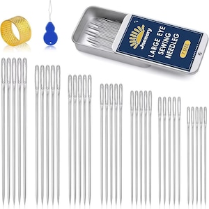 May include: A sewing kit with various needles, a thimble, and a needle threader. The kit includes a metal tin with the text "LARGE EYE SEWING NEEDLEG" and "7 SIZE". The thimble is gold, and the needle threader is blue.
